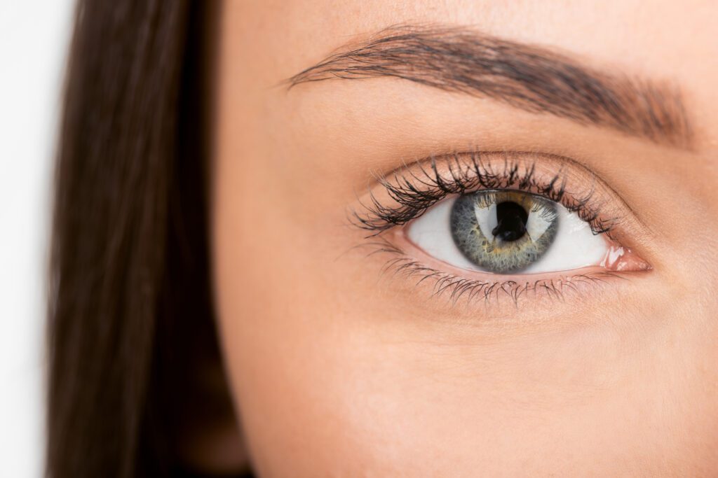 close-up shot of woman with beautiful eye looking at camera